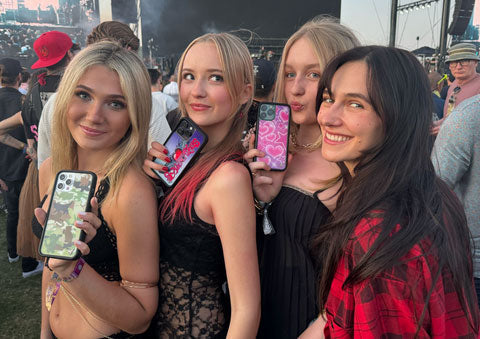 Devon Lee Carlson poses with three girls with Wildflower cases