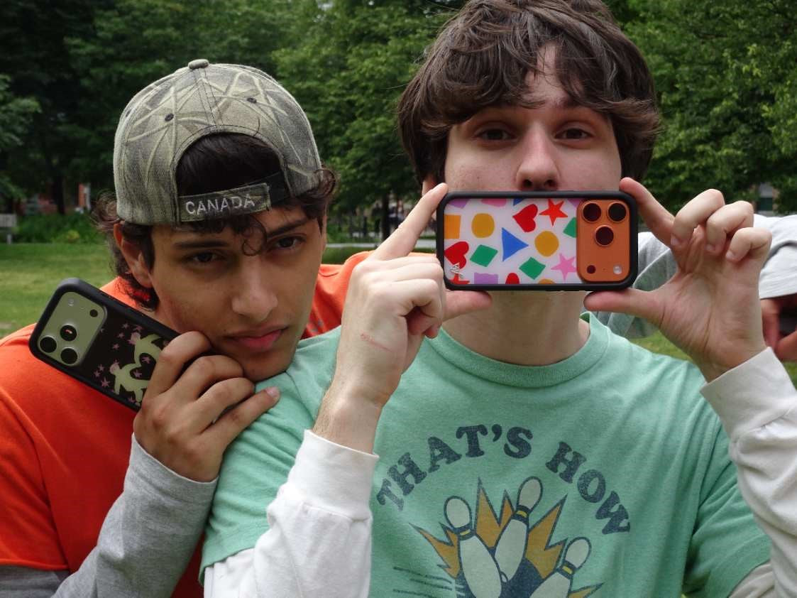 Slushy Noobz pose holding up their Wildflower Cases