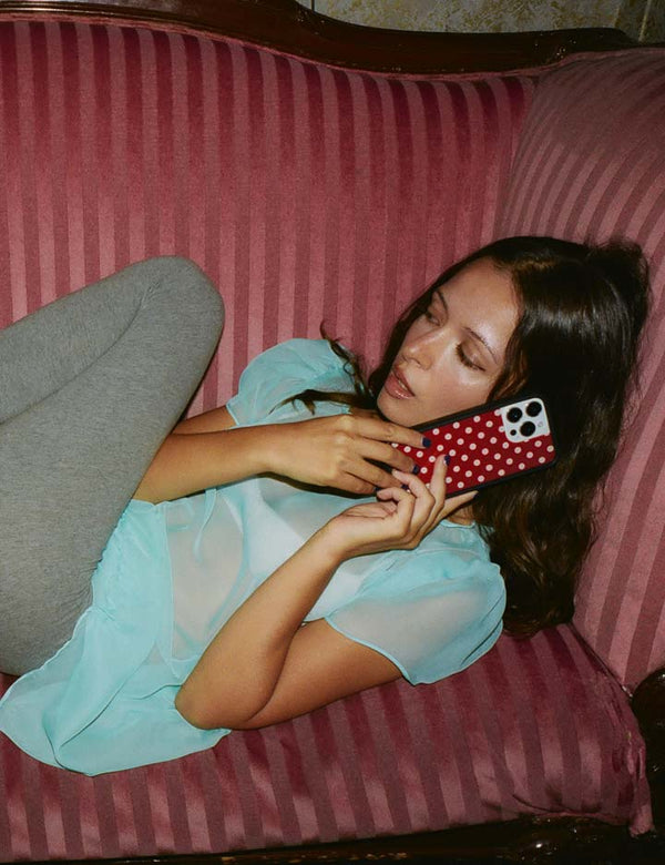 Lifestyle Image 02 Polka Dot Burgundy and Cream iPhone Case