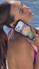 devon carlson showing off the new dolphin dreams purple phone case from wildflower cases